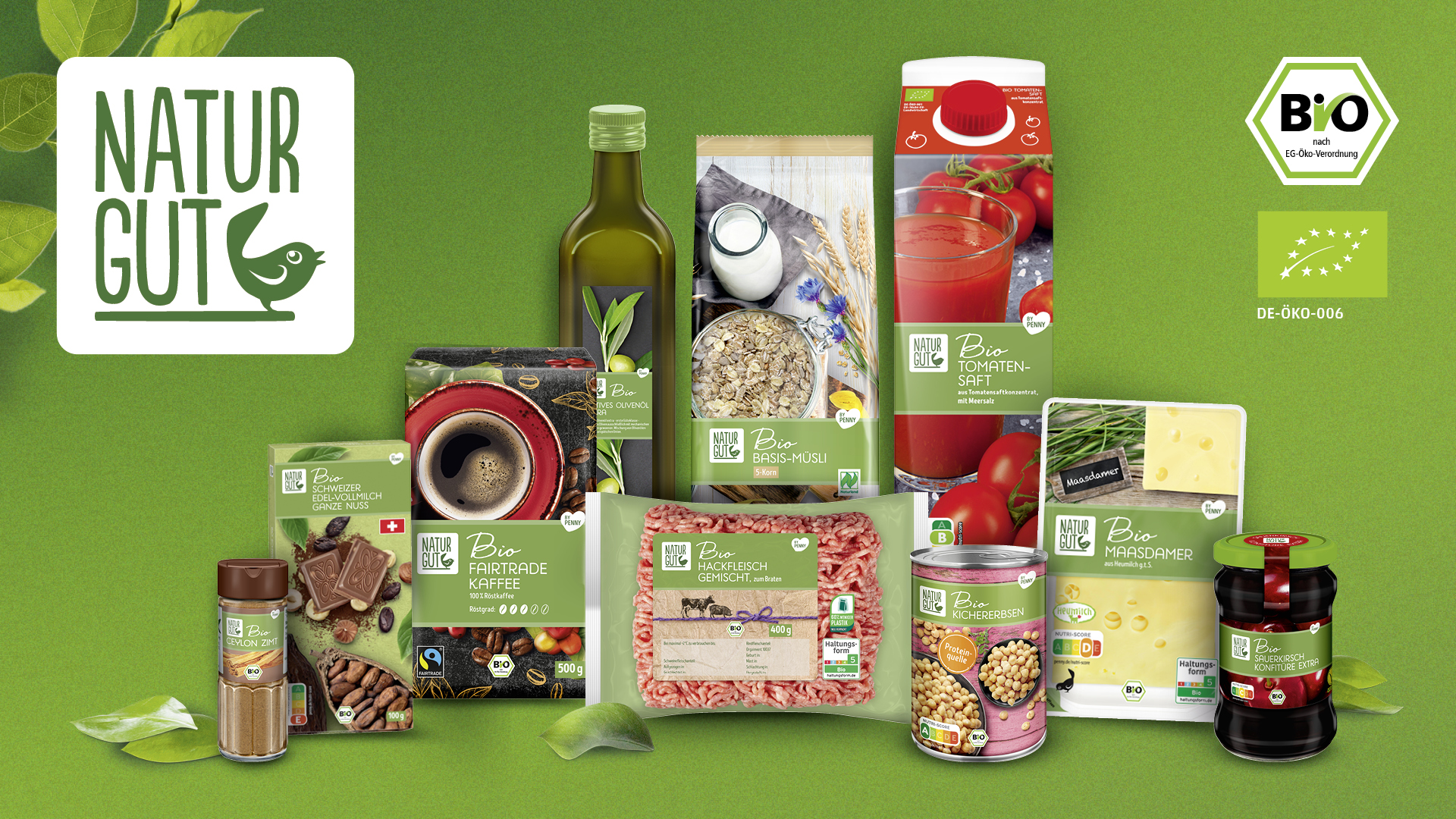 Various organic food products from the Naturgut brand, such as oil, oats, tomato juice, spices, cheese and tinned foods, are arranged against a green background alongside the Naturgut logo and the organic label.